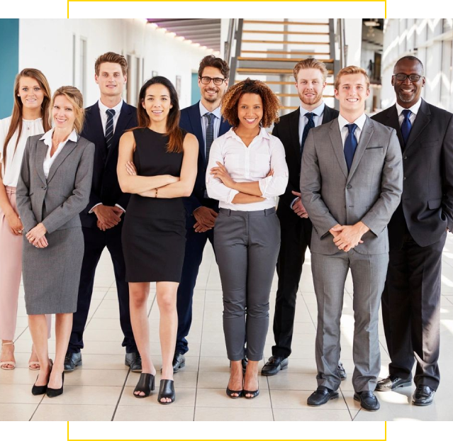 A group of people in business attire standing together.